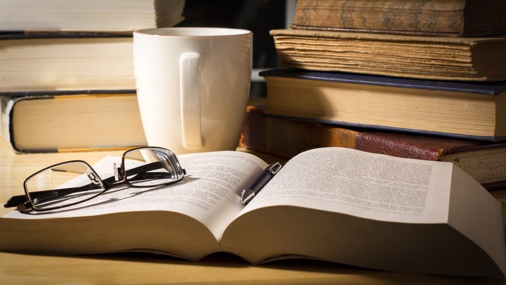 bigstock-Pile-of-Books-on-a-Table-41566999